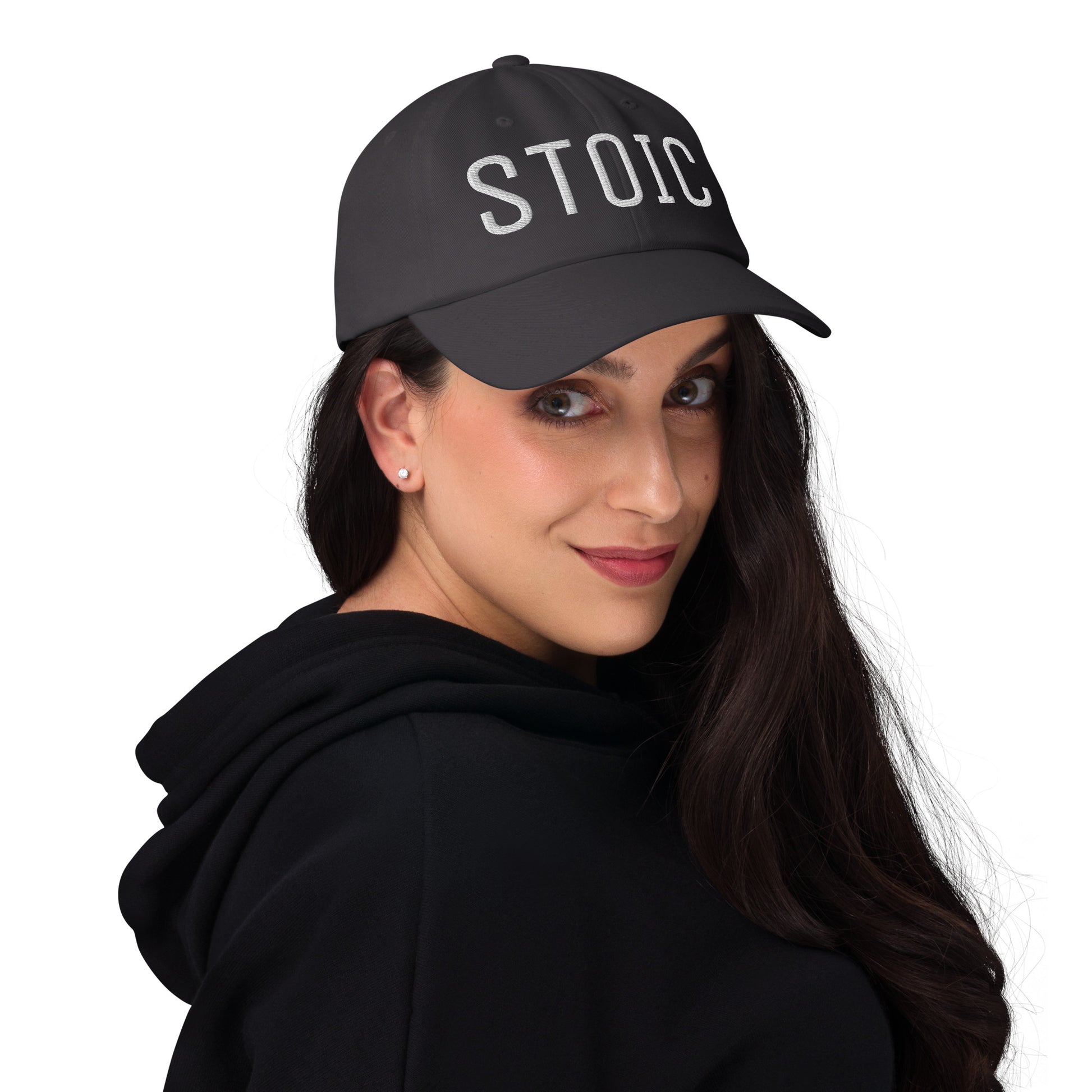 Black Stoic embroidered dad hat worn by a woman in a hoodie, promoting Stoic philosophy.