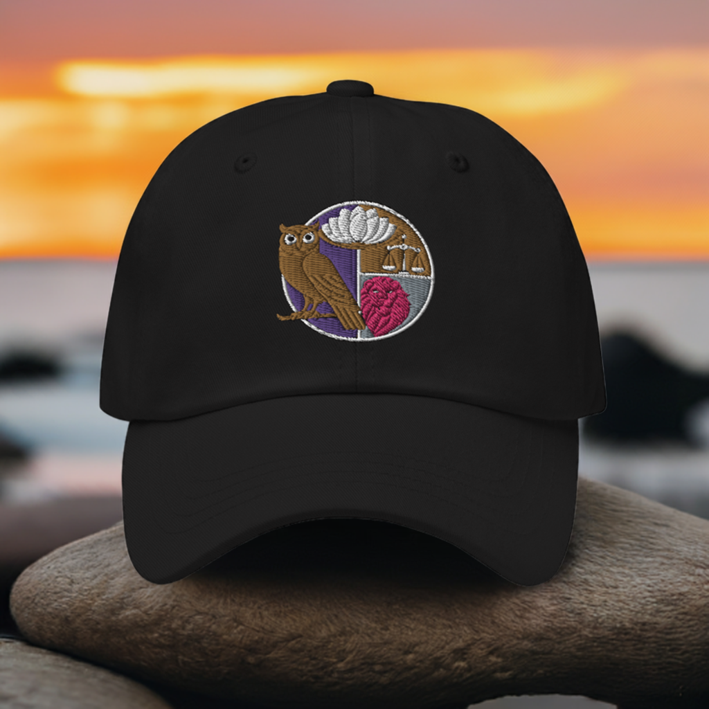 Embroidered dad hat featuring the four Stoic virtues design with an owl, lotus flower, scales, and heart on a black background, perfect for Stoicism enthusiasts.